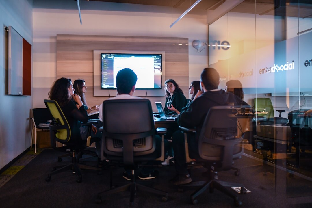Diverse team of analysts meeting in a modern office in Belgium